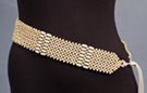 checker-board mesh of spherical beads interspersed with rows of oblong beads, double twine tie on either end